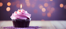 Birthday Purple Cupcake With Candle On Light Purple Boke