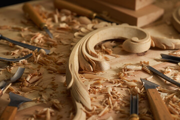 Canvas Print - Carpenter. Wood carving close-up photo. Wooden engraving