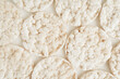 Round puffed crispy rice crackers on a white background.