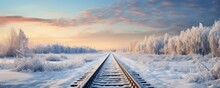 Railway Tracks In Snowy Winter Landscape