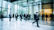 © Alfonso Soler - Long exposure shot of crowd of business people walking in bright office lobby fast moving with blurry