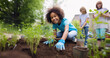 © IBEX.Media - Little girl planting seedlings in garden