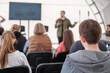 © Anton Gvozdikov - Businessman giving presentation to male colleagues in conference hall