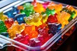 close-up of colorful gummy bears in a small lunchbox compartment