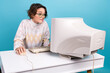 Photo of nervous lady biting lips use retro pc mouse keyboard workstation desktop isolated on blue color background