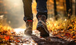 Close-up of male legs, man walking in autumn forest, Go on a nature hike, relax and recharge concept
