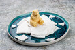 Ice cream shaped like a teddy bear sitting on ice floes s ice cream. Haute cuisine.