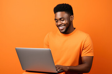 Wall Mural - Side view young smiling African American man wears t-shirt casual clothes hold use work point on laptop pc computer browsing internet isolated on orange red color background studio