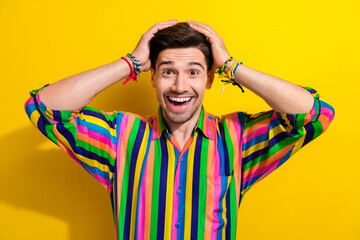 Sticker - Portrait of amazed funny man striped colorful shirt vintage style party he forgot his tickets to enter isolated on yellow color background