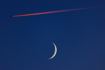 Wall Mural - blue sky with moon and flying airplane