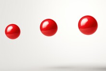  A Group Of Three Red Balls In The Middle Of A White Background With One Red Ball In The Middle Of The Picture And One Red Ball In The Middle Of The Picture.