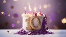 Purple And Golden Cake With Number 10 On A Table Decorated For A Party Celebration