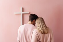 Back Of Fashion Family Couple In White Clothes Looking At The Cross Of Jesus. Church, Worship, Christianity Concept. Men And Woman, Husband, Wife, Bride, Groom, Guy And Girl On Pastel Background