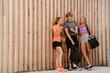 © Drobot Dean - Portrait of three cheerful fitness people resting after workout while standing outdoors