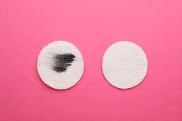 Wall Mural - Clean and dirty cotton pads after removing makeup on pink background, flat lay