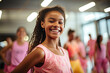 Cheerful young African American girl with a vibrant smile during a dance class promoting an upbeat and energetic fitness lifestyle