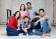 © Photographielove - portrait of happy indian family sitting at sofa