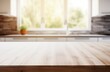 © Sara_P - blank Wooden counter table in front of blurry white kitchen  background,product mockup