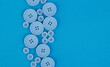 © Valeria F - Background of blue fabric with blue buttons of different sizes