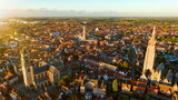 Fototapeta Konie - Aerial of Belfry of Bruges is a medieval bell tower Bruges Belgium. 4k