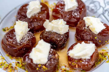 Sticker - Traditional stuffed dried fig dessert with walnuts and cream, cooked with syrup (Turkish name: fig dessert with cream).​