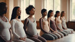 © AdriFerrer - Line of diverse pregnant women practicing prenatal yoga.