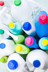 Wall Mural - Top view of some liquid soap bottles on blue background