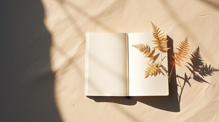 Poster - The shadow of a home plant falls on a blank sheet of an open notebook. A simple concept of planning things, learning, making lists, keeping a diary. Flat lay. Top view. Copy space.