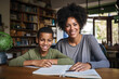 © Bojan - Mother and Son Work on Homework