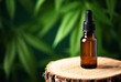 CBD hemp oil in a bottle against cannabis leaf background. Hemp herbal alternative medicine.