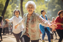 Elderly Women Dancing In Park. Happy Square Dance Senior People In China. Outdoor Physical Activity For Grandparents