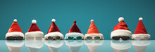 Row Of Santa Hats And Sunglasses - Christmas Quirky Charm - Style - Holiday Fashion - Blue Background 