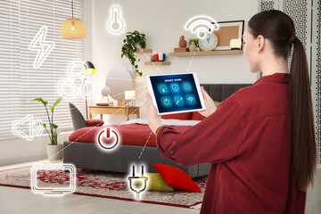 Canvas Print - Woman using smart home control system via application on tablet indoors. Different icons connected with device