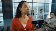 Portrait of hispanic businesswoman present start up marketing idea to investor. Female leader present brainstorming business plan written on sticky notes on glass wall at business meeting. Manipulator