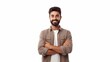 Standing with his arms crossed on a white background, a happy, self-assured young man with a beard has copy space to the left of him. Indian Pakistani Arabic from South Asia Eastern Middle East