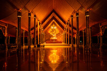 The Golden Buddha Statue Is Housed In A Beautiful Chapel. At Phu Prao Temple Ubon Ratchathani Province In Thailand