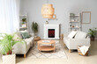 © Pixel-Shot - Interior of light living room with fireplace and grey sofas