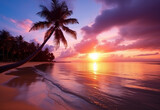 Fototapeta Zachód słońca - Beautiful sunset over the sea with a view at coconut tree on the white beach