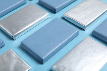 Wall Mural - Blue chocolate bars on a blue background