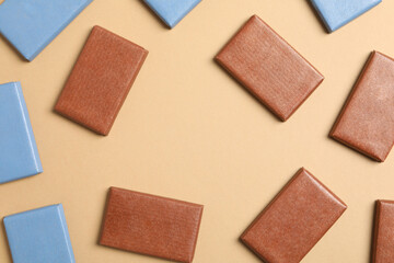 Sticker - Blue and brown chocolate bars on a light background