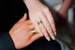 © andrey - Female and male hand with wedding rings.