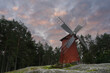 Old wooden mill on the Åland Islands at sunset.