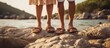 Closeup couple's legs in sandals standing on a coastal rocks. AI generated image