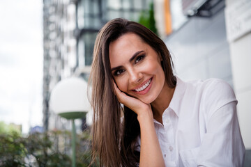 Poster - Portrait of cheerful lovely girl hand touch cheek toothy smile have good mood pastime town center outside