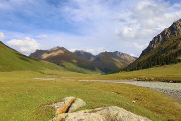 Wall Mural - Ak-Suu valley with a glacier river on Fifth stage of Ak-Suu Traverse trek in Tian Shan mountains, Karakol, Kyrgyzstan