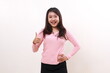 © ArvStd - Happy pretty smiling young asian girl standing while showing thumbs up. Satisfied concept. Isolated on white