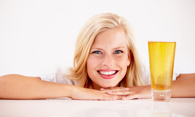 Canvas Print - Woman, portrait and smile with beer drink in studio for weekend relax, summer beverage on white background. Female person, face and model or alcohol glass as pint enjoyment, cider ale or mockup space