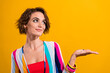 Photo of stunning sweet cute lady disco performer wear retro striped shirt hold hand mockup look news isolated on yellow color background