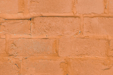 Wall Mural - Orange peach color paint on silicate blocks, brick wall, old texture, background, close-up