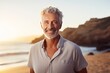 Attractive Mature Man with Gray Hair Enjoying Beach Sunset”